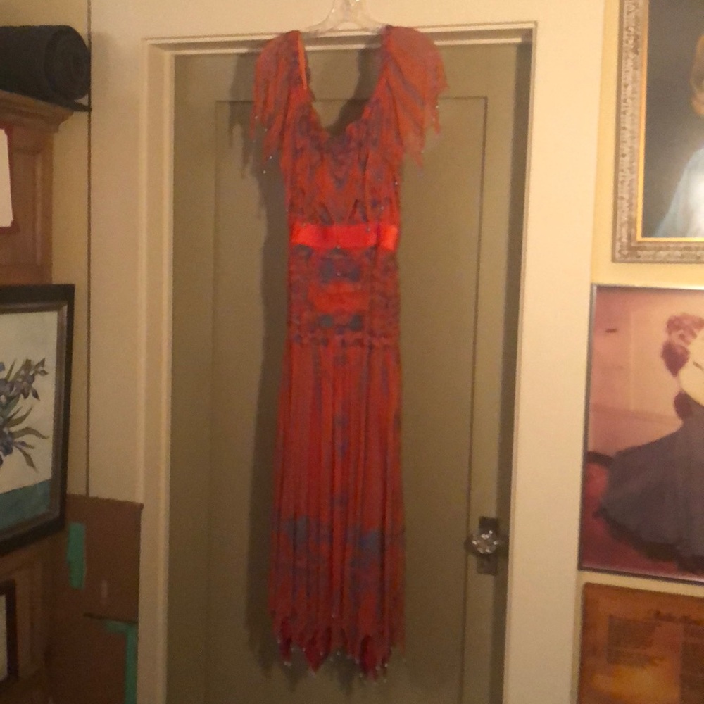 Red dress with blue beads near top & bottom